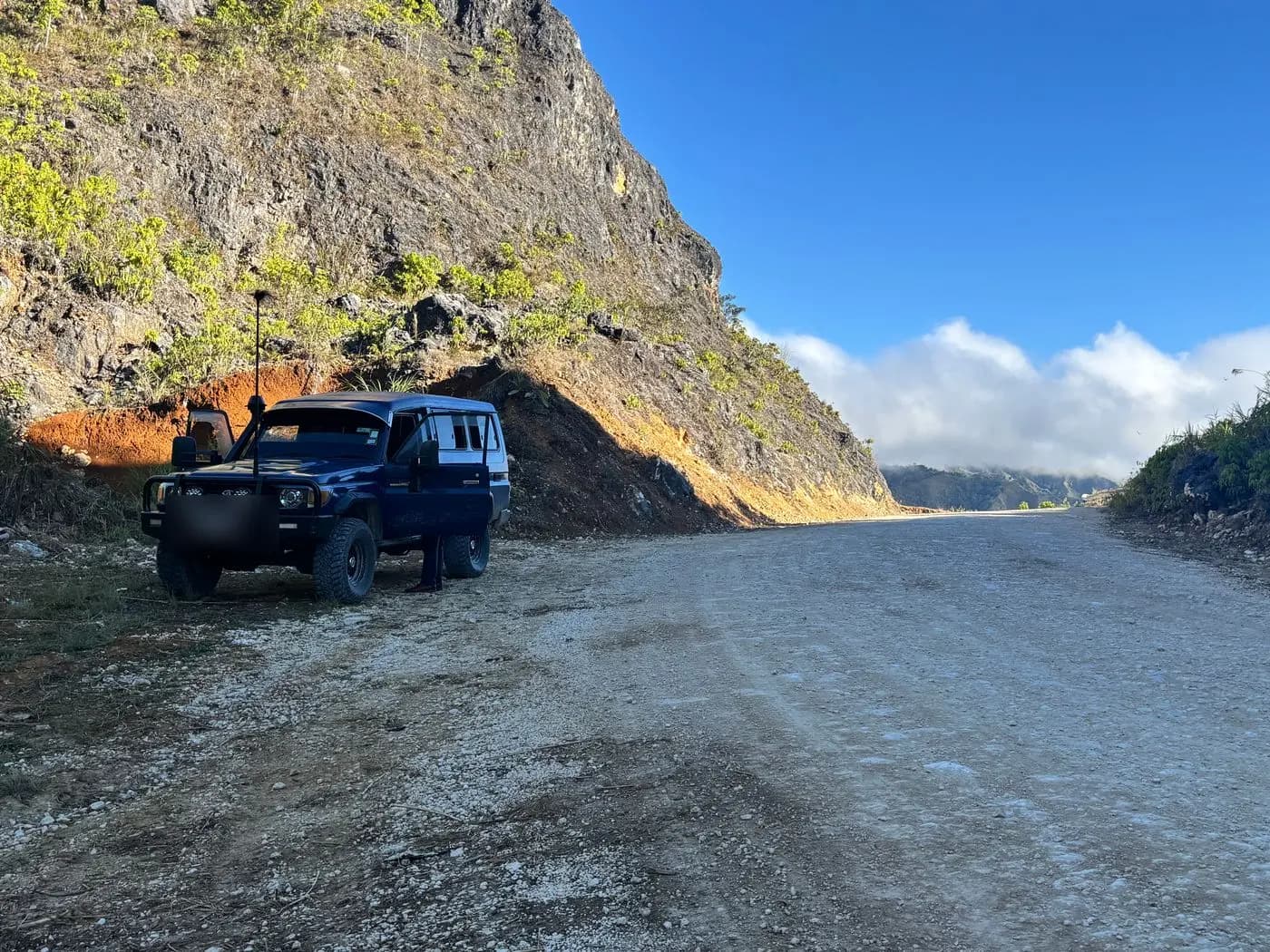 GPS360 field vehicle parked on a highlands road cut during a Starlink deployment